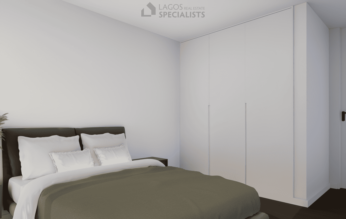 sleek bedroom with built-in wardrobes in 2-bedroom new build Lagos apartment