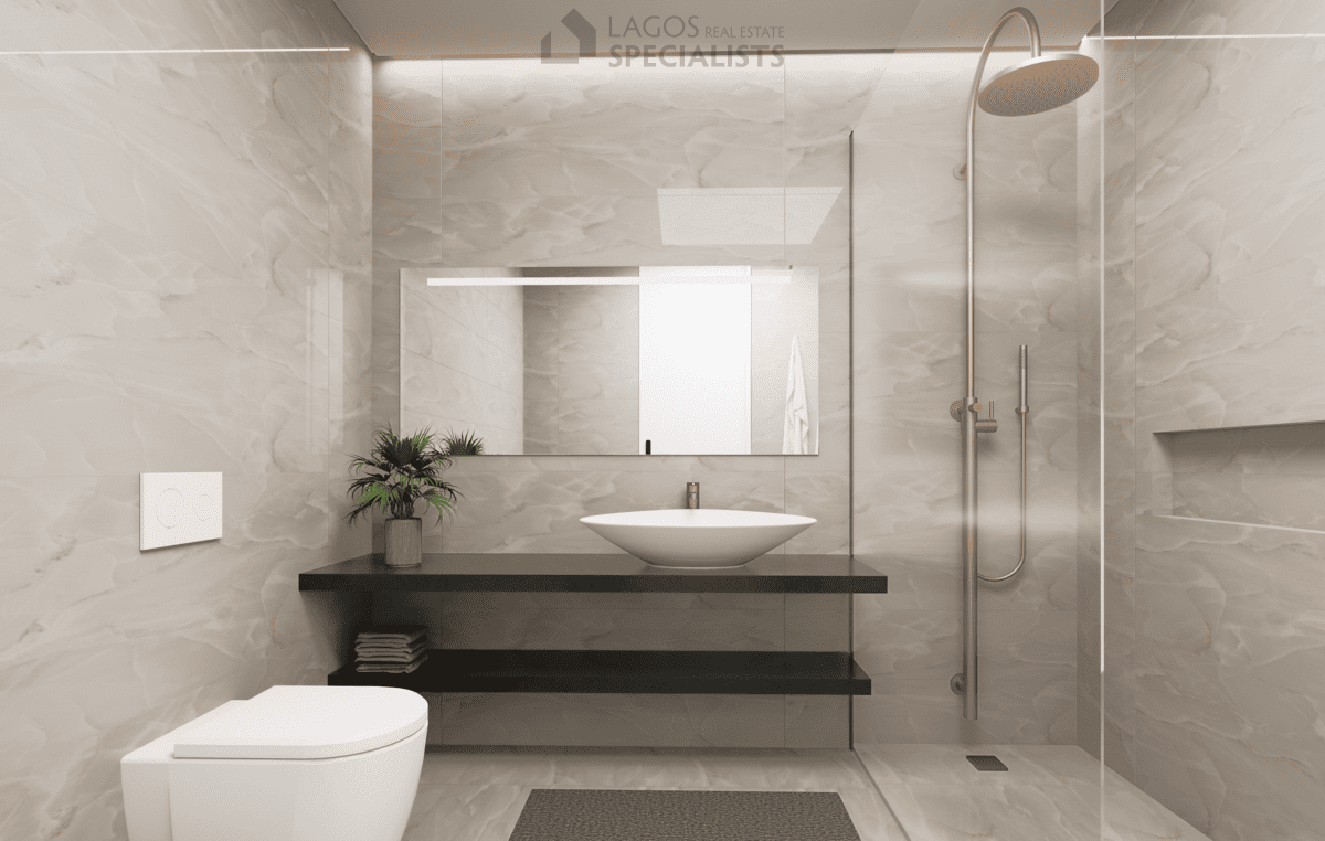 modern bathroom with suspended sink and walk-in shower in 1-bedroom new build apartment Lagos