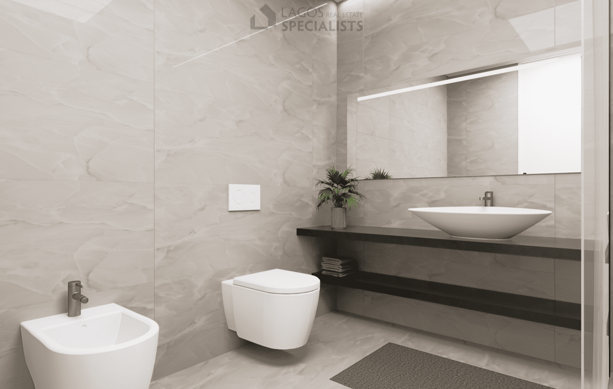 sleek bathroom with suspended fittings and walk-in shower in new build apartment Lagos