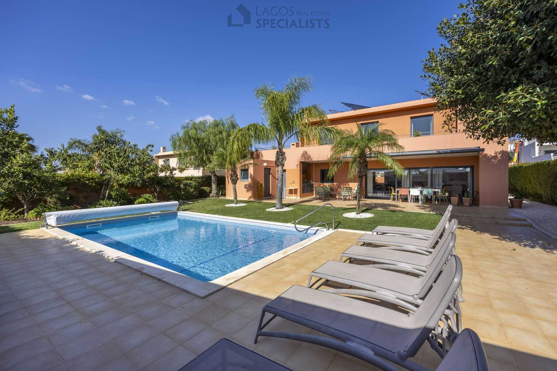 Modern villa with private pool and sun loungers in Lagos, Portugal