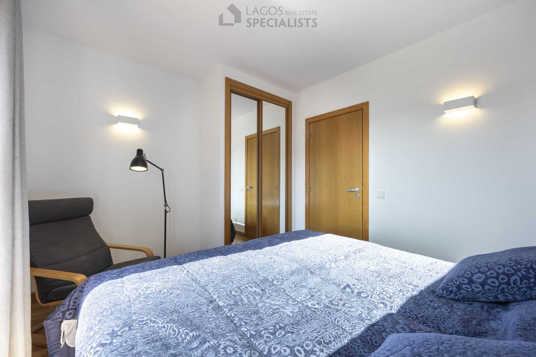 Guest bedroom with modern decor and balcony access, Lagos Algarve