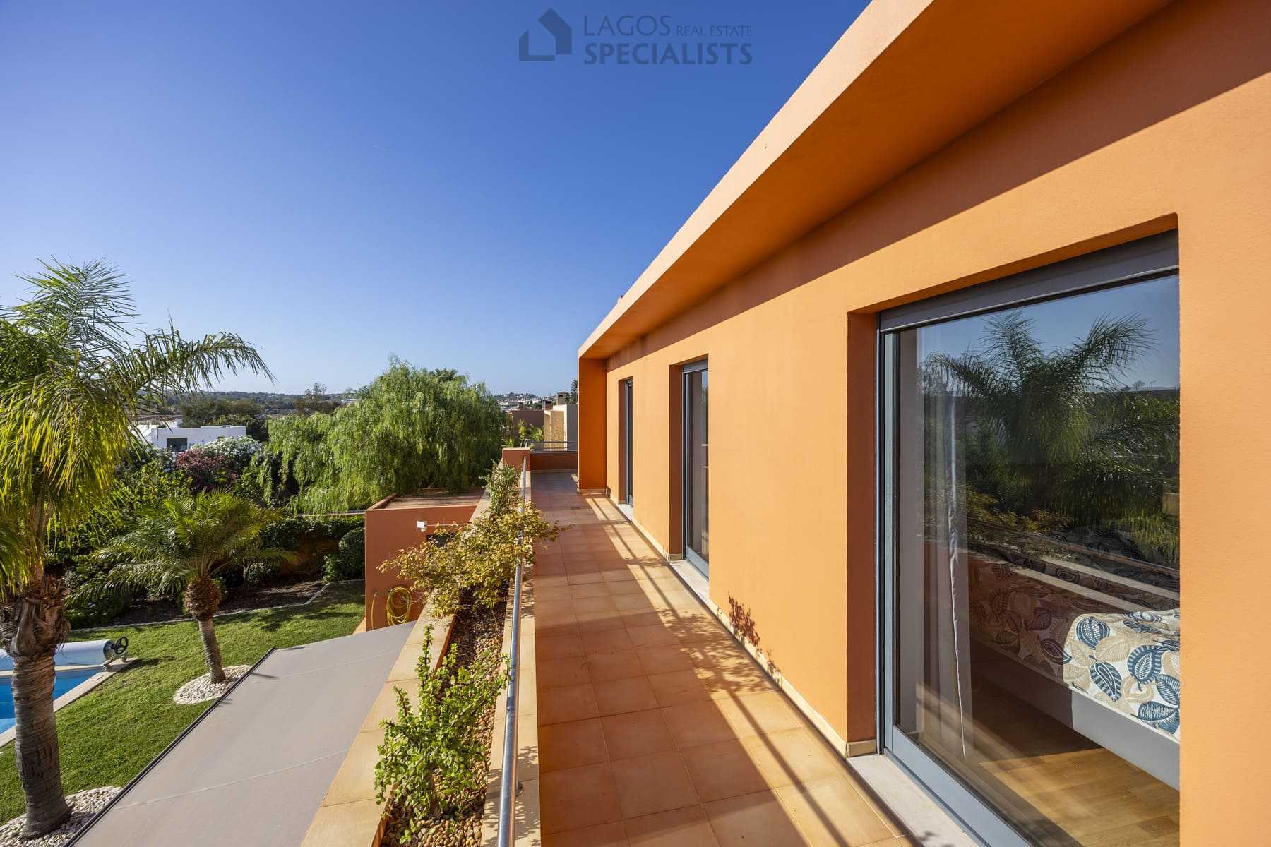 Terrace with access to bedrooms and pool view, Lagos home