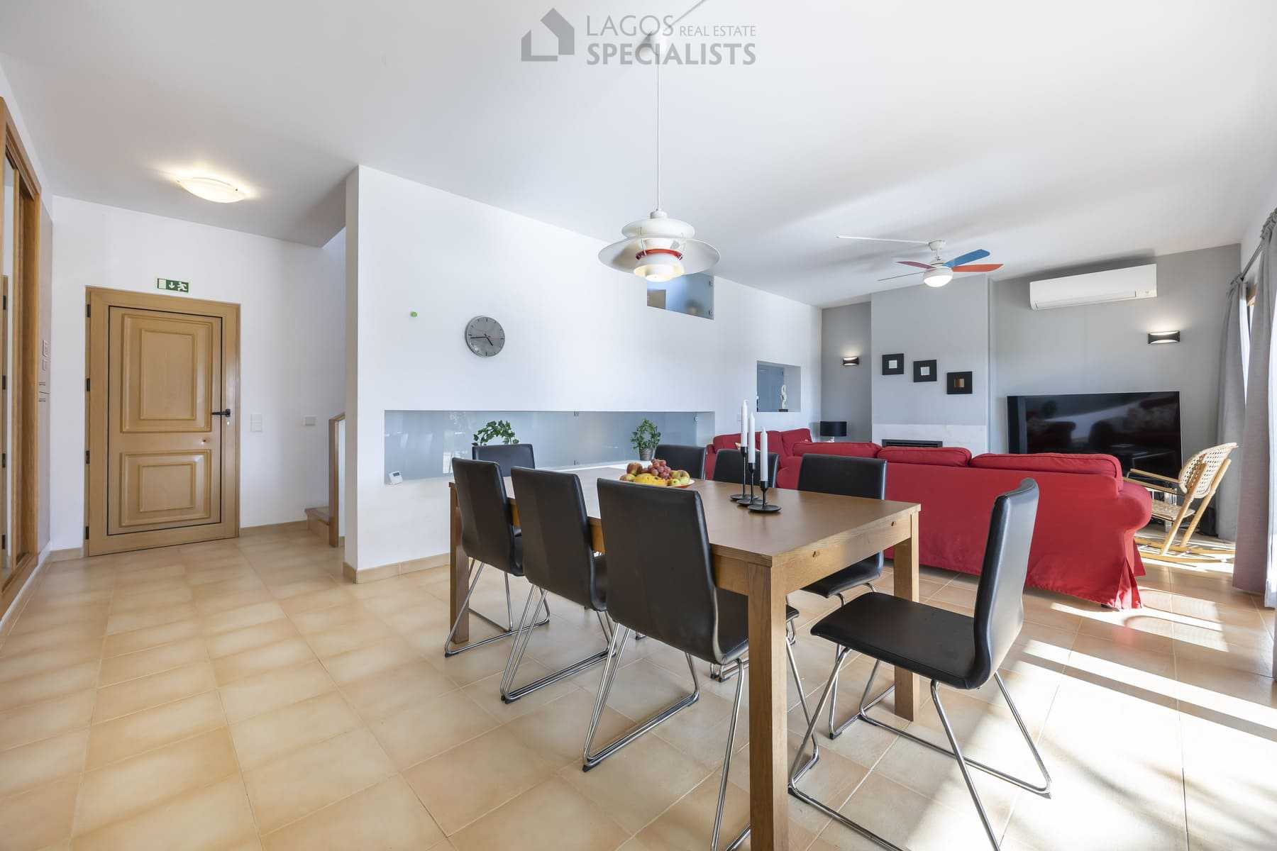 Modern dining area with wooden table and natural light, Lagos property
