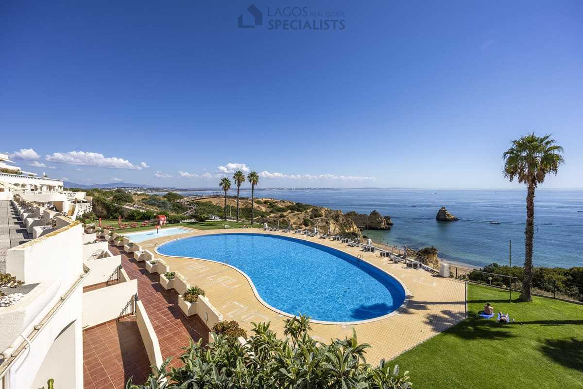 Ocean-view pool terrace with kids pool and sun loungers at Iberlagos near Dona Ana Beach, Lagos Algarve