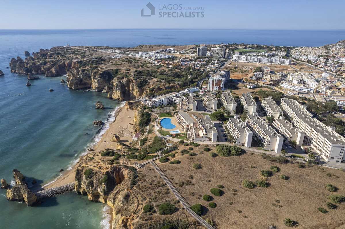 Aerial overview of Iberlagos resort and Dona Ana Beach with Lagos coastline and cliffs