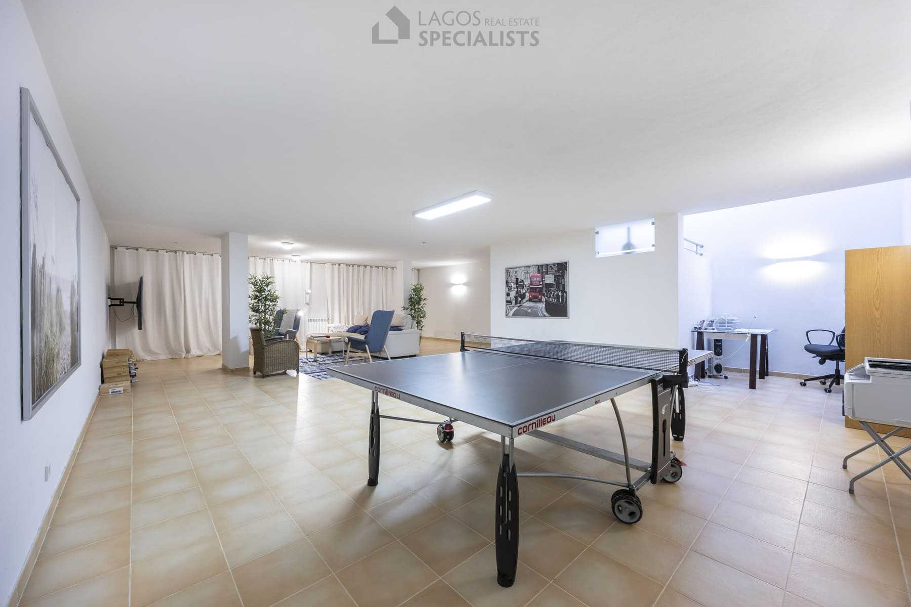 Basement games room with ping pong table and office corner, Lagos property