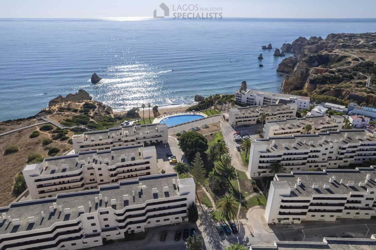 Panoramic aerial of Iberlagos resort above the Algarve coastline and Ponta da Piedade cliffs, Lagos