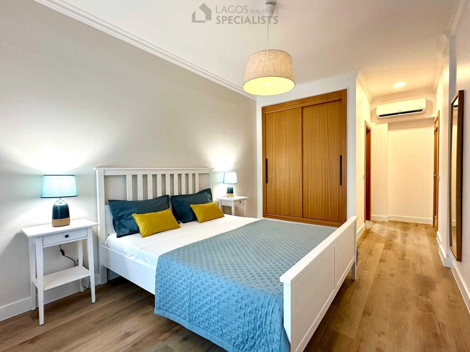 Master bedroom with built-in wardrobe and soft neutral design