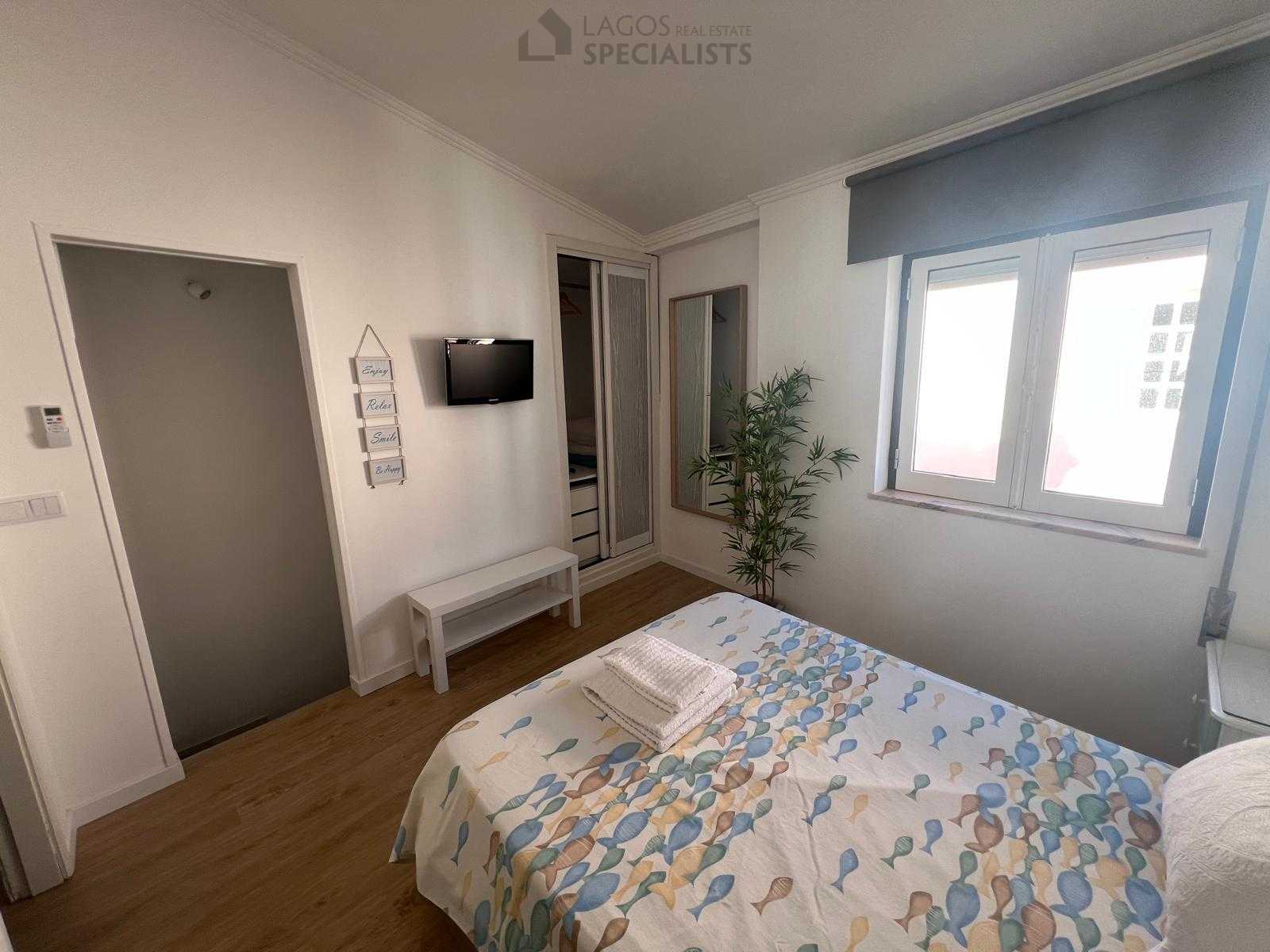 Cozy master bedroom with natural light and coastal decor – Lagos property for sale