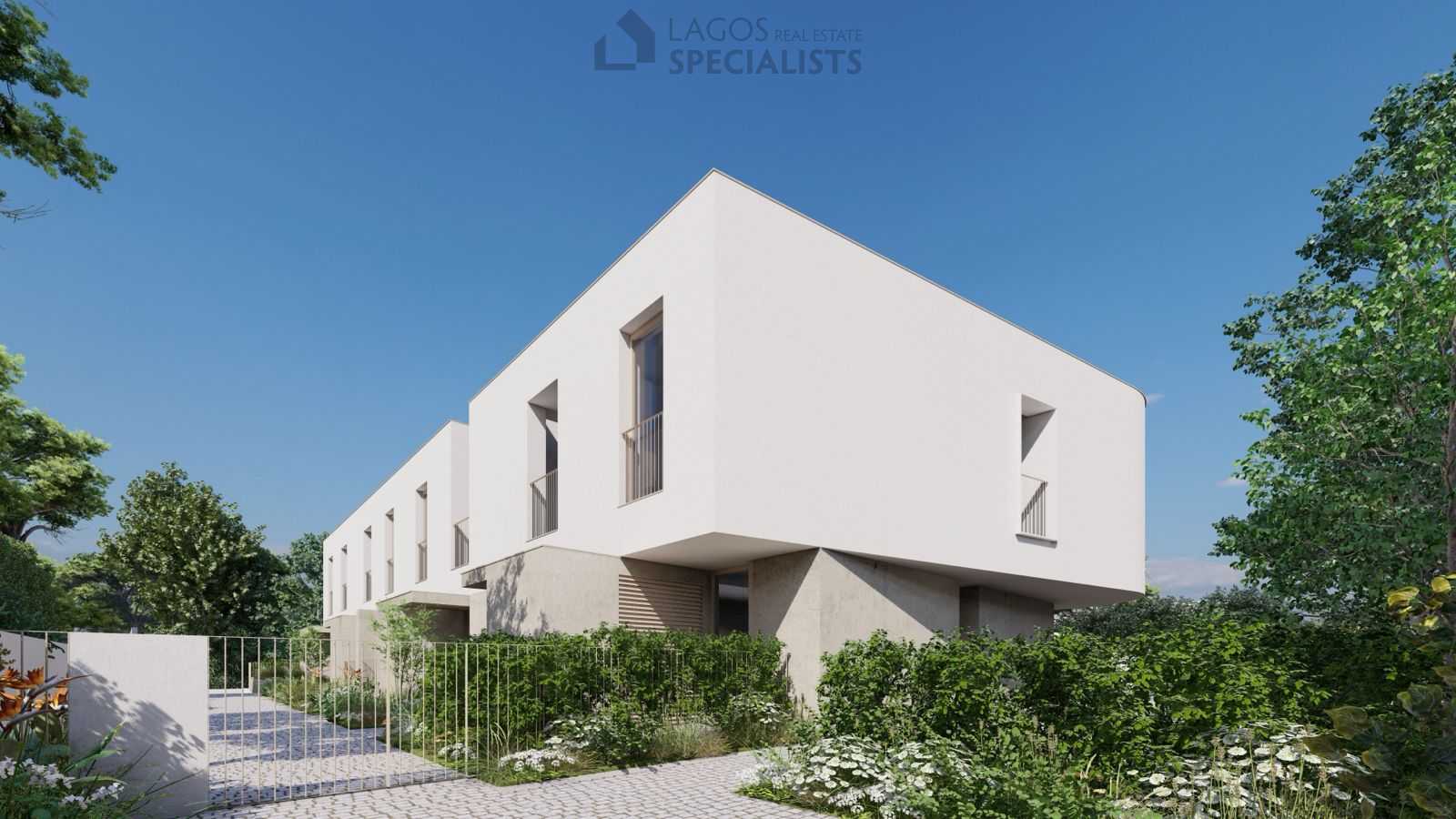 Modern white townhouses with clean minimalist design and pool view in Lagos, Algarve