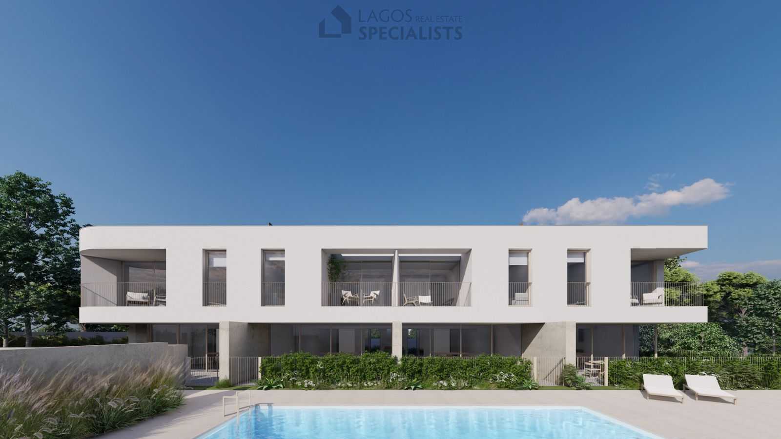 Shared swimming pool and sun terrace surrounded by greenery at modern Lagos development