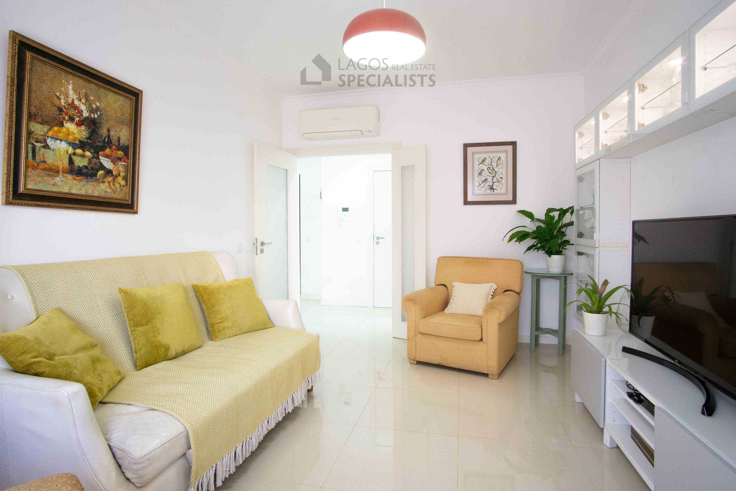 Bright, modern living room with furniture.