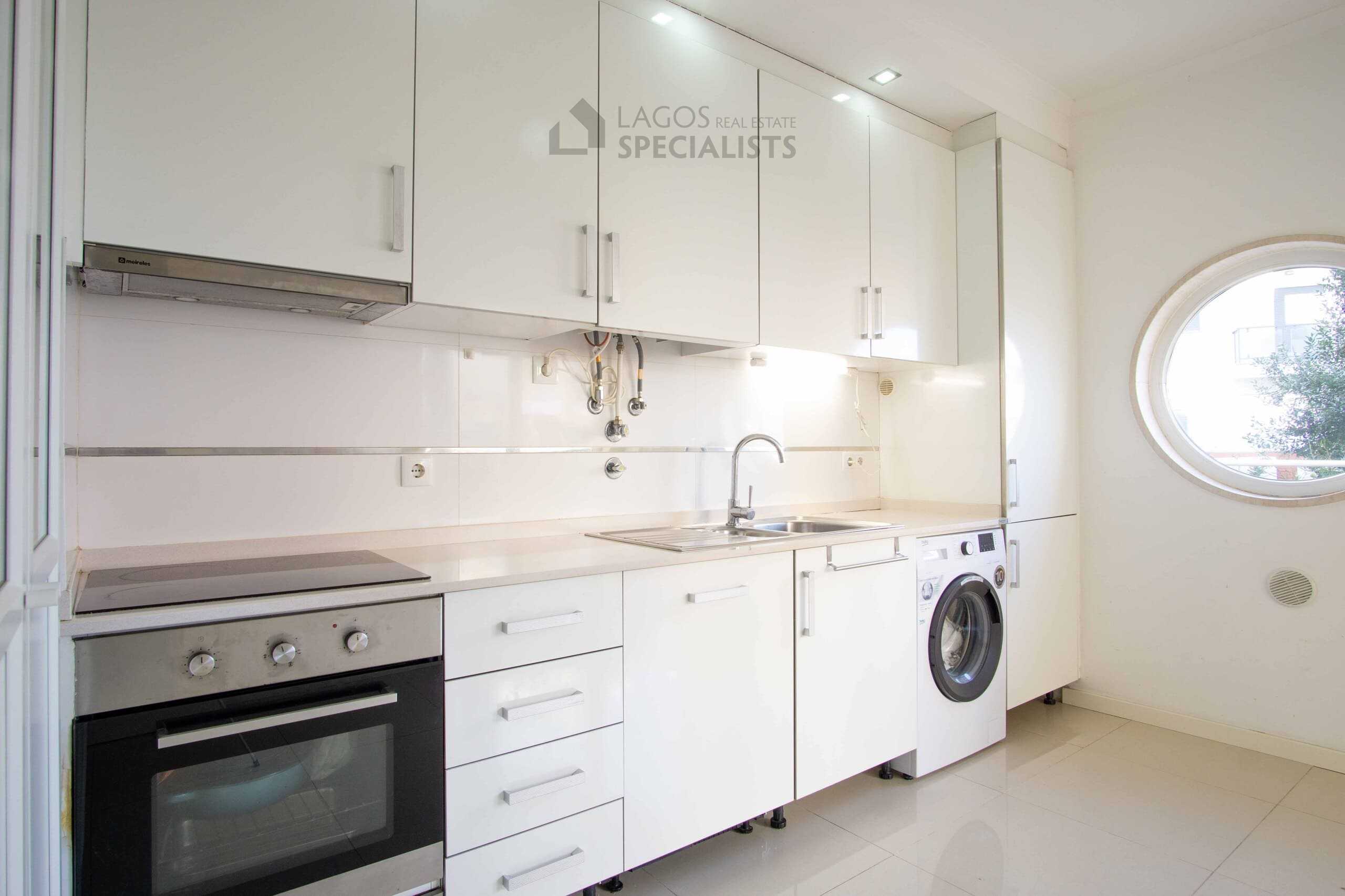 Modern kitchen with white cabinetry