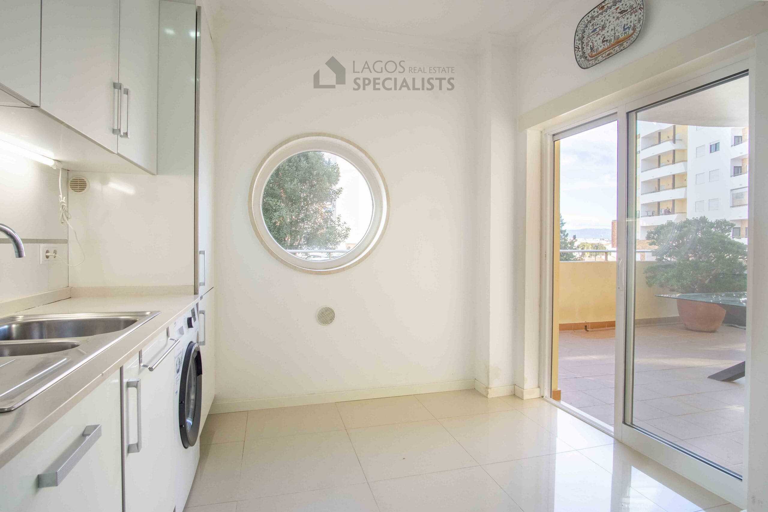 Bright kitchen with circular window