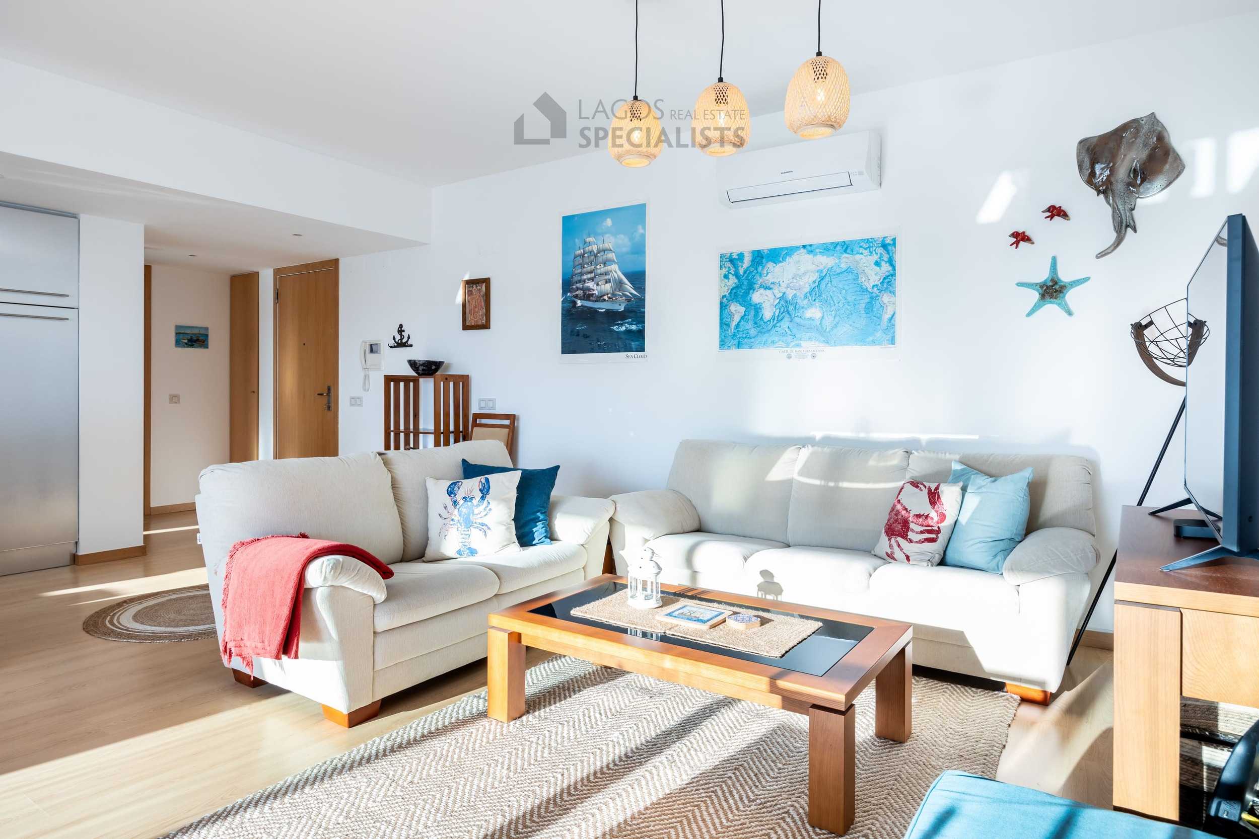 Open plan dining area with large sliding doors leading to terrace in Lagos Marina apartment