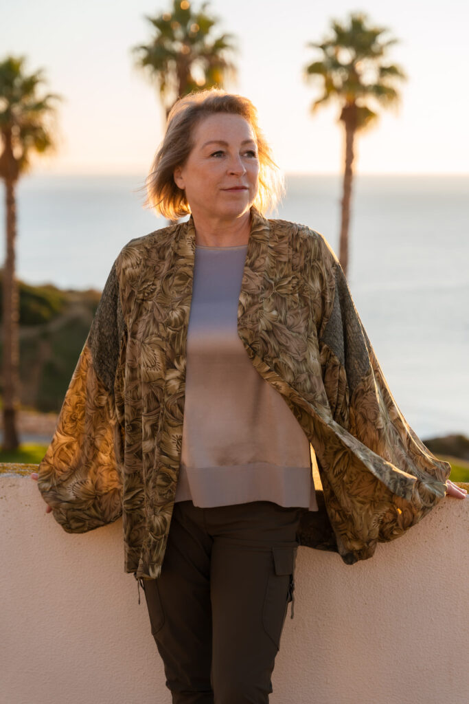 Natasha Hunt on Algarve real estate tips with palm trees and coastal background