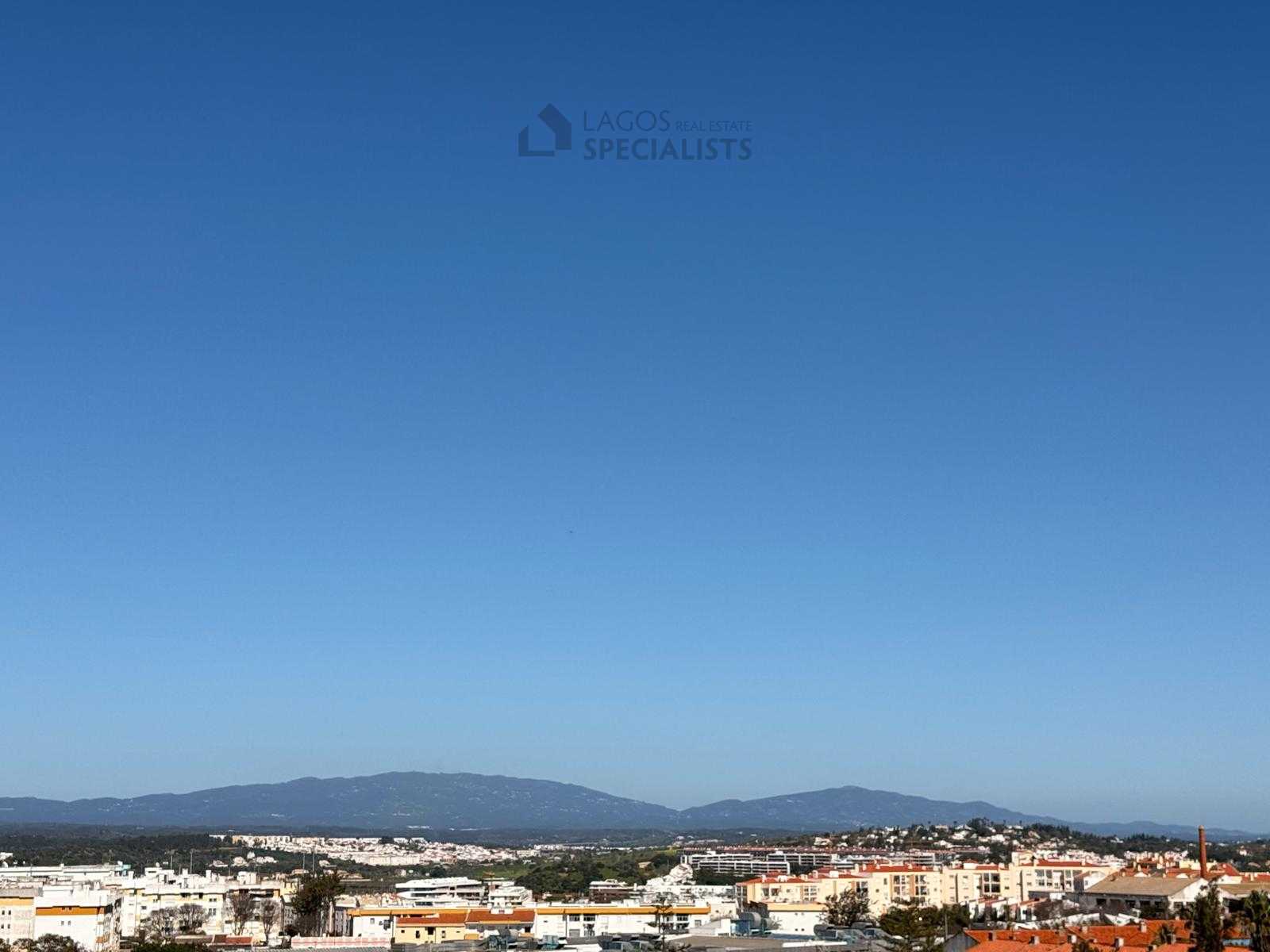 Panoramic city and mountain views from rooftop terrace in Lagos Algarve