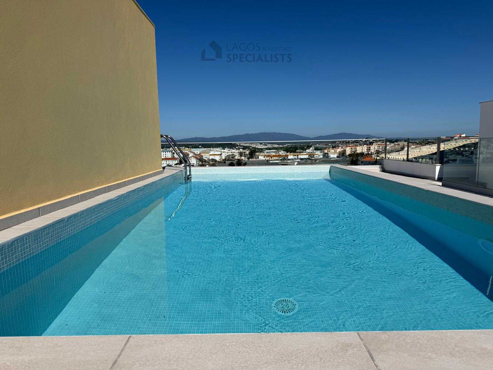 Rooftop swimming pool with panoramic views in central Lagos apartment complex