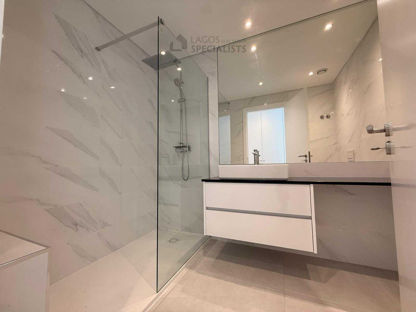Sleek bathroom with walk-in shower