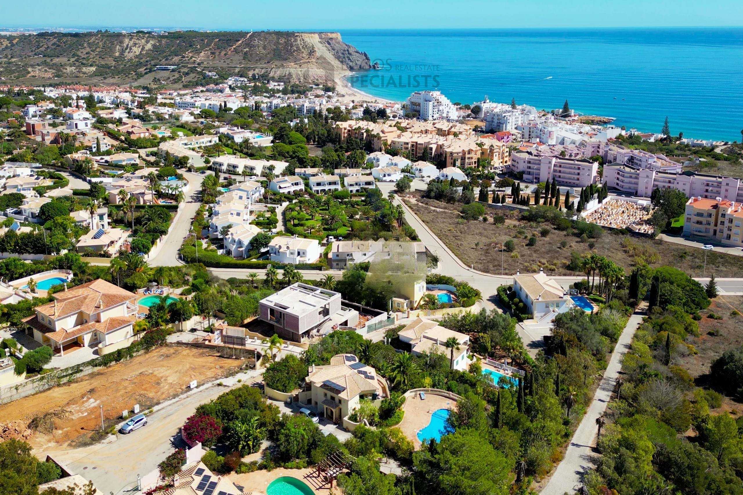 Wide panoramic aerial view of Praia da Luz, coastline and surrounding Algarve neighbourhoods