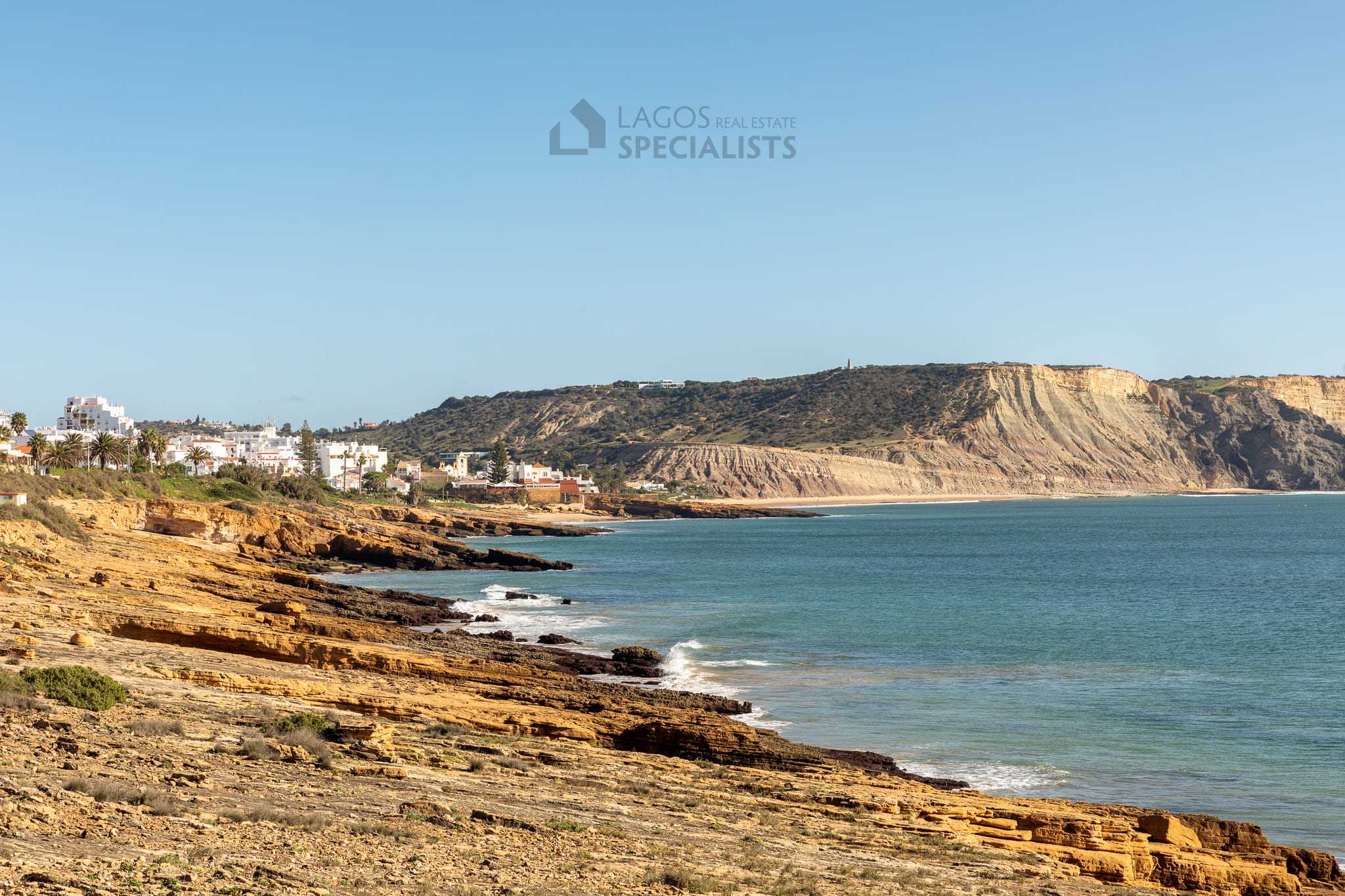 Aerial view of Praia da Luz coastline and golden cliffs in the west Algarve